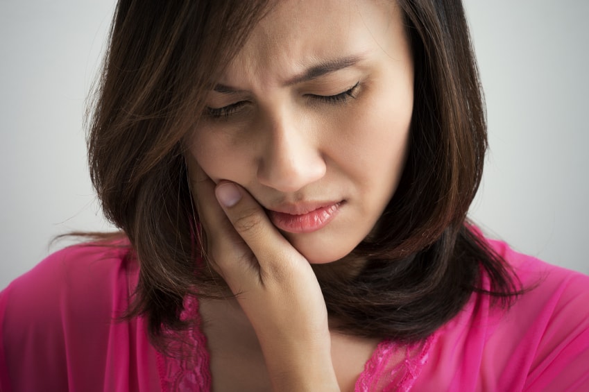 Young lady debunking the myth about gum bleeding is typical & normal in South Ogden & Kaysville.