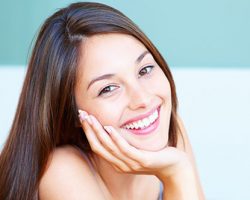 A lady choosing gum reshaping to correct uneven gum lines in South Ogden and Kaysville, UT.