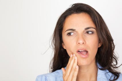 brunette women with tooth ache hand on mouth