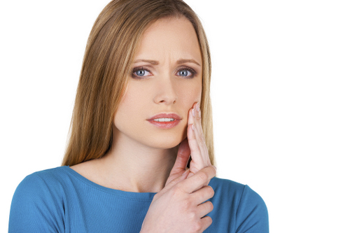 A lady having a Gum Disease pain