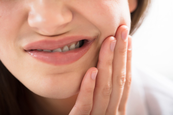 A lady having a Gum Disease pain