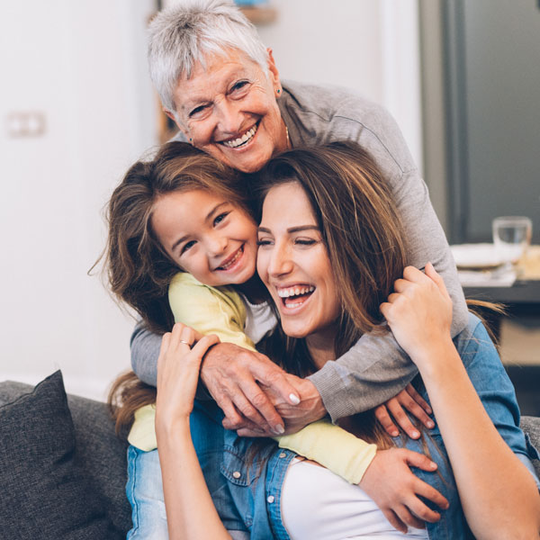 laughing family of three